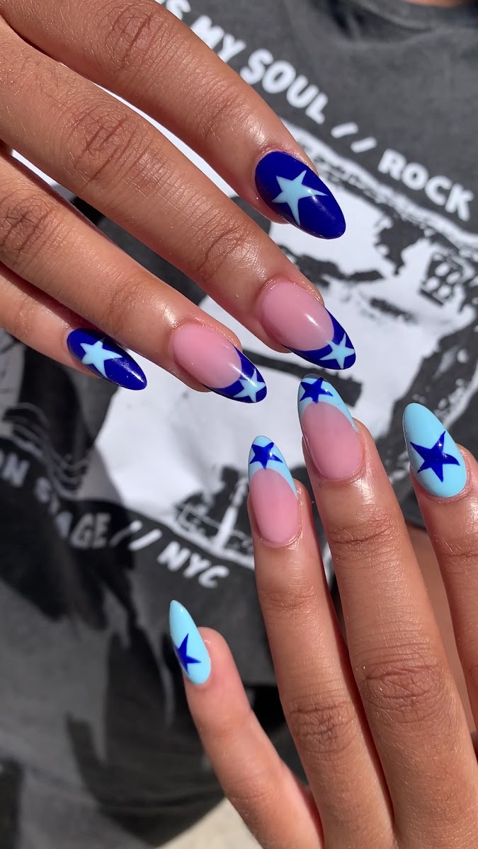 Blue star French-tip gel nails designed at Pedi N Nails Fergus in Fergus, ON